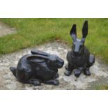 Pair of cast iron models of seated Rabbits.