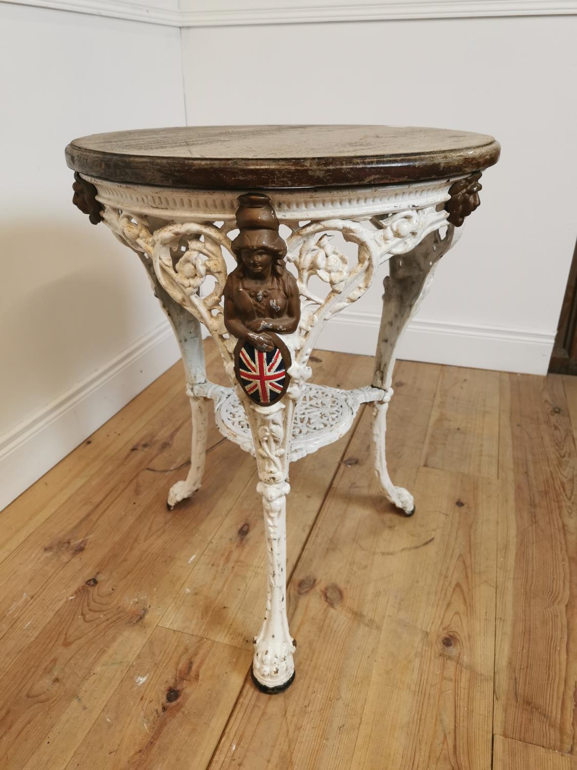 19th C. cast iron book table on lion's paw feet