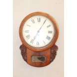 Mahogany wall clock with brass pendulum.