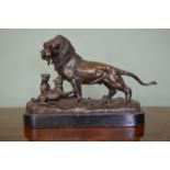 Bronze Lion with cubs on oval marble base.