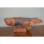 Carved drift wood sculpture of a Fish on wooden base.