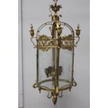 Ornate brass hall lantern with etched glass panels.