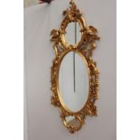 Decorative carved gilt treble mirror surmounted by Ho Ho birds