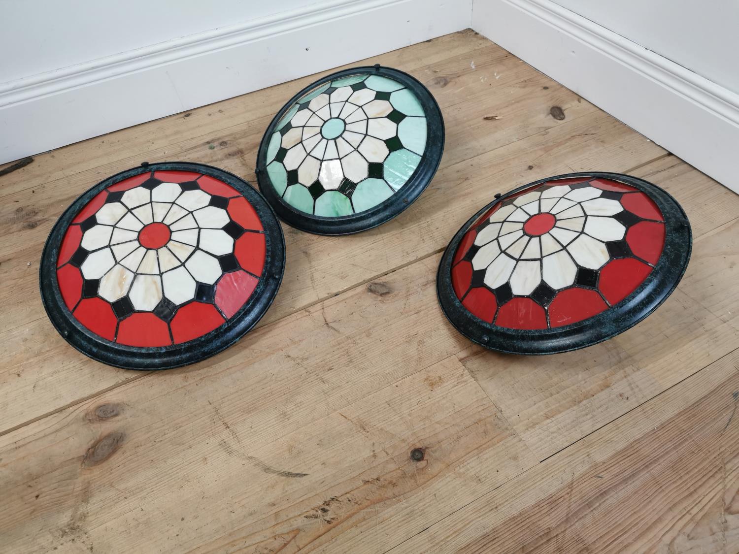 Three leaded glass dish light shades.