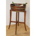 Wooden and metal bound wine cooler stand.