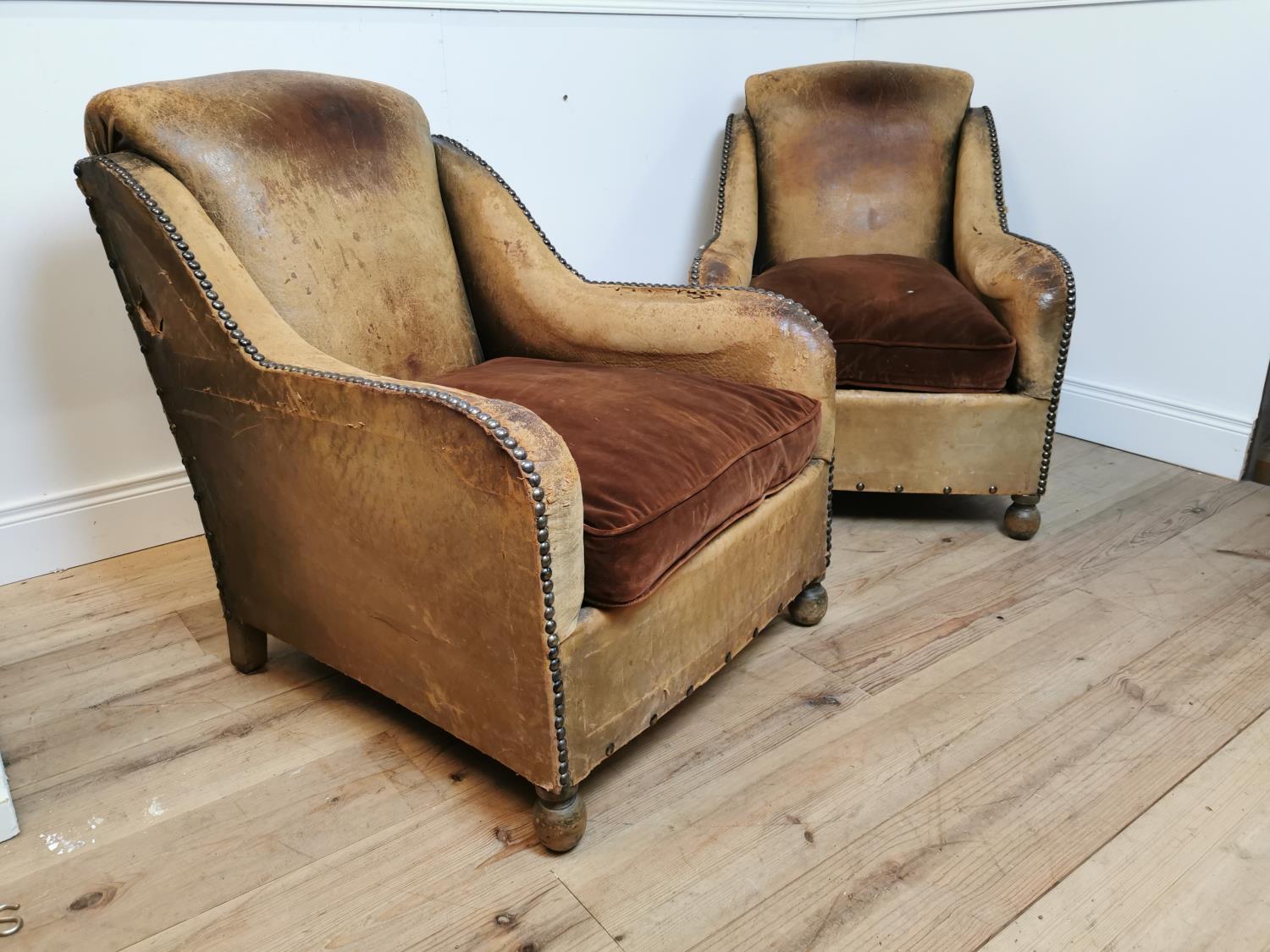 Pair of Art Deco tanned leather tub chairs with brass studs