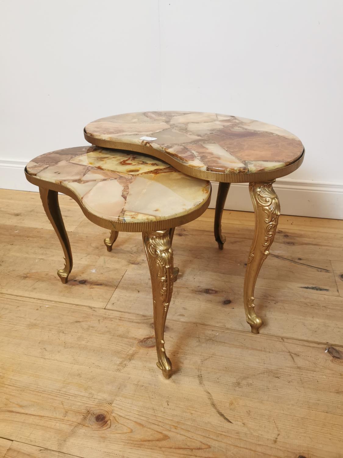 Nest of two gilded metal lamp tables