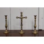 Brass cross and two candlesticks.