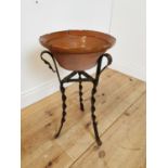Early 20th C terracotta glazed bowl on wrought iron stand.