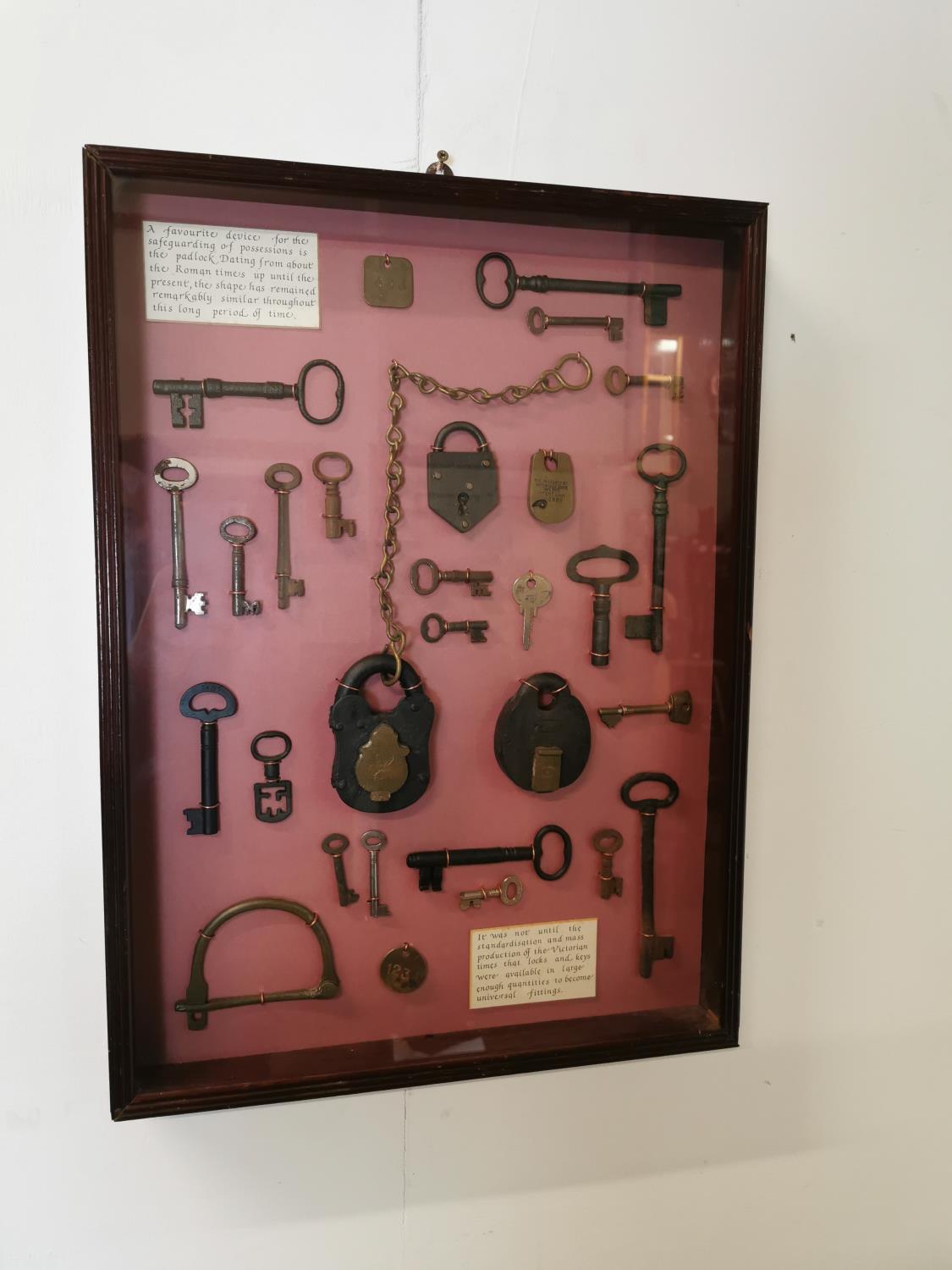 Framed montage of Victorian keys and locks.