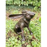 Exceptional quality bronze model of Hare scratching ears