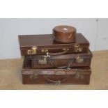 Two leather suitcases, briefcase and collar case.