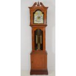 Mahogany longcase clock with brass dial.