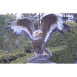 Cast iron model of an Eagle with outswept wings.