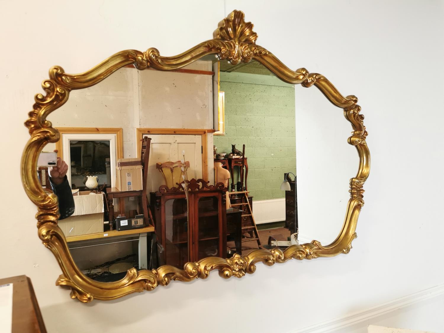 Decorative gilt wall mirror in the Rococo style