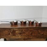 Good quality set of four graduated copper saucepans