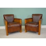 Pair of fine quality cherrywood and leather club arm chairs .