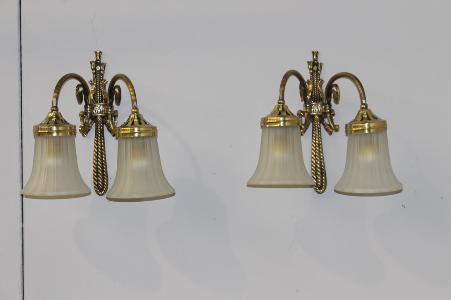 Pair of two branch brass wall lights