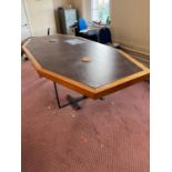 Unusual boardroom table, the top fitted with TANDBERG recording system, standing on a metal base {