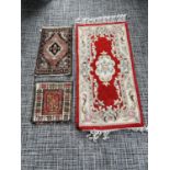 Three various rugs, including Persian prayer rug { Largest 60 cm W x 120 cm L}