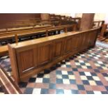 Two pews fronted with mahogany panels.