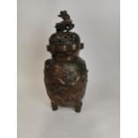 Large Oriental bronze figural vase with Shi Shi Lion decoration and finial lid.. {60 cm H x27 cm