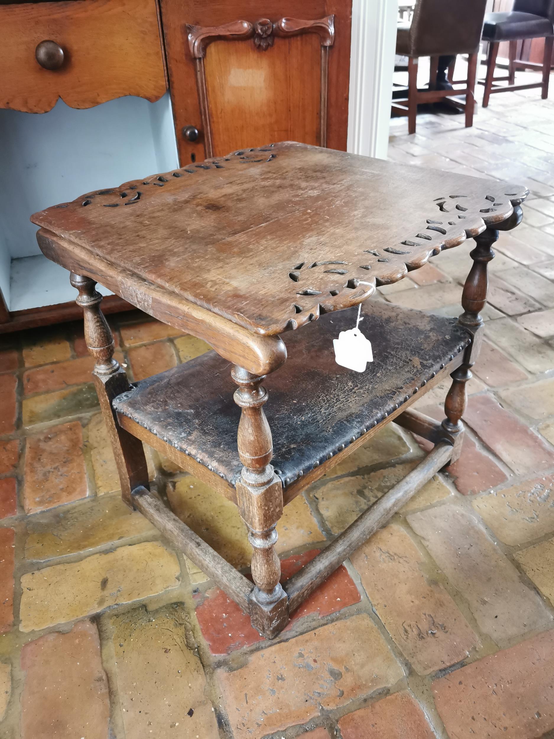 Unusal Edwardian oak settle chair with leather upholstered seat and raised on turned legs { 55cm H X - Image 2 of 4