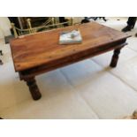 Hardwood coffee table with metal mounts { 41cm H X 100cm W X 62cm D }.