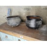 Two 19th. C. metal three legged pots { 22cm H X 31cm Dia }