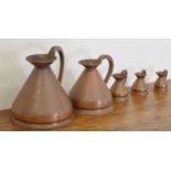 Set of five graduated haystack copper measures. Largest {28 cm H x 25 cm Dia}.