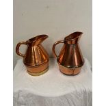 Two Georgian brass and copper measures { 39cm H & 36cm H }.