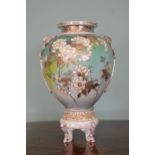 Porcelain vase with floral decoration on scroll feet. {35 cm H x 21 cm Dia}.