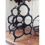 Two cast iron wine racks and a chrome wine rack. { 34cm H, 25cm H and 6cm H }