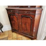 20th. C. mahogany corner cupboard, the two astragal glazed doors over two blind doors raised on
