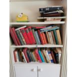 Two shelves of books - novels dictionaries etc.