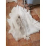Goat skin rug { 131cm L X 116cm W }.