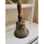 19th. C. brass school bell with wooden handle { 29cm H X 16cm Dia }.