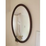 Edwardian mahogany mirror with oval plate { 53cm H X 77cm W }
