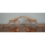 Pair of brass cannons on carriages. {22 cm H x 40 cm W}.