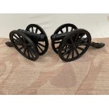 Pair of cast iron cannons { 35cm H X 76cm L }.