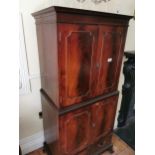 20th. C. veneered mahogany drinks' cabinet the two panelled doors over two panelled doors above