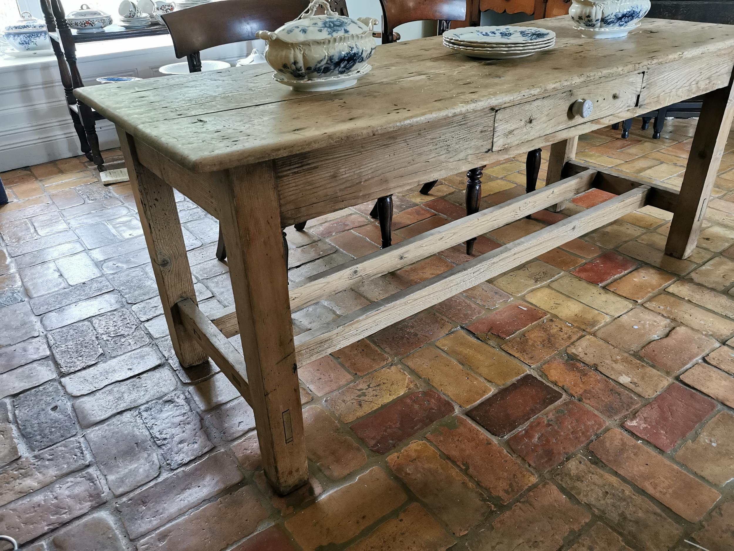 19th. C. stripped pine kitchen table, with single drawer in the frieze raised on square legs and