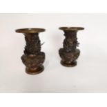 Pair of bronze Japanese Meiji period vases with coiling dragon decoration. {24 cm H x 15 cm Dia}.