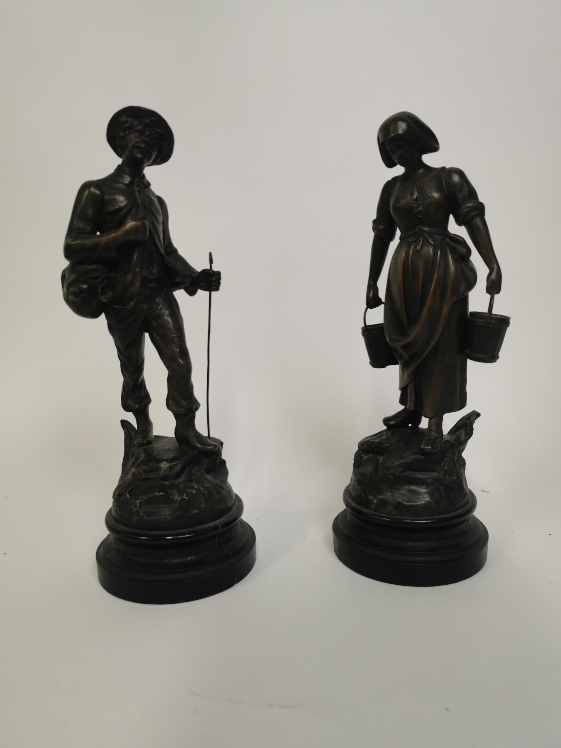 Pair of bronzed spelter figures of Man and Lady. Man {37 cm H x 12 cm Dia} and Lady {35 cm H x 12 cm