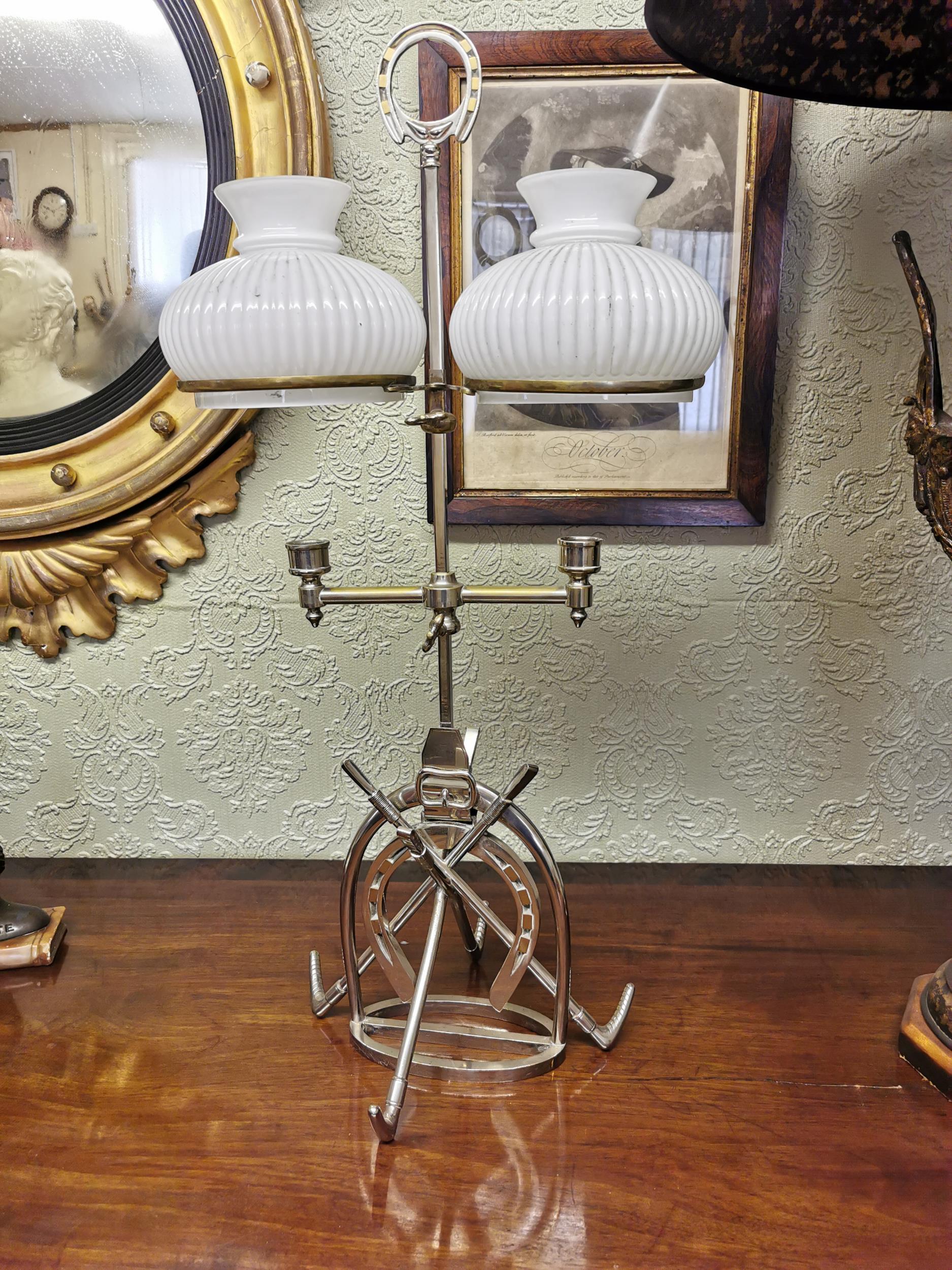 EPNS desk lamp in the form of a horse shoe with whips. { 66cm H X 35cm W X 26cm D }.