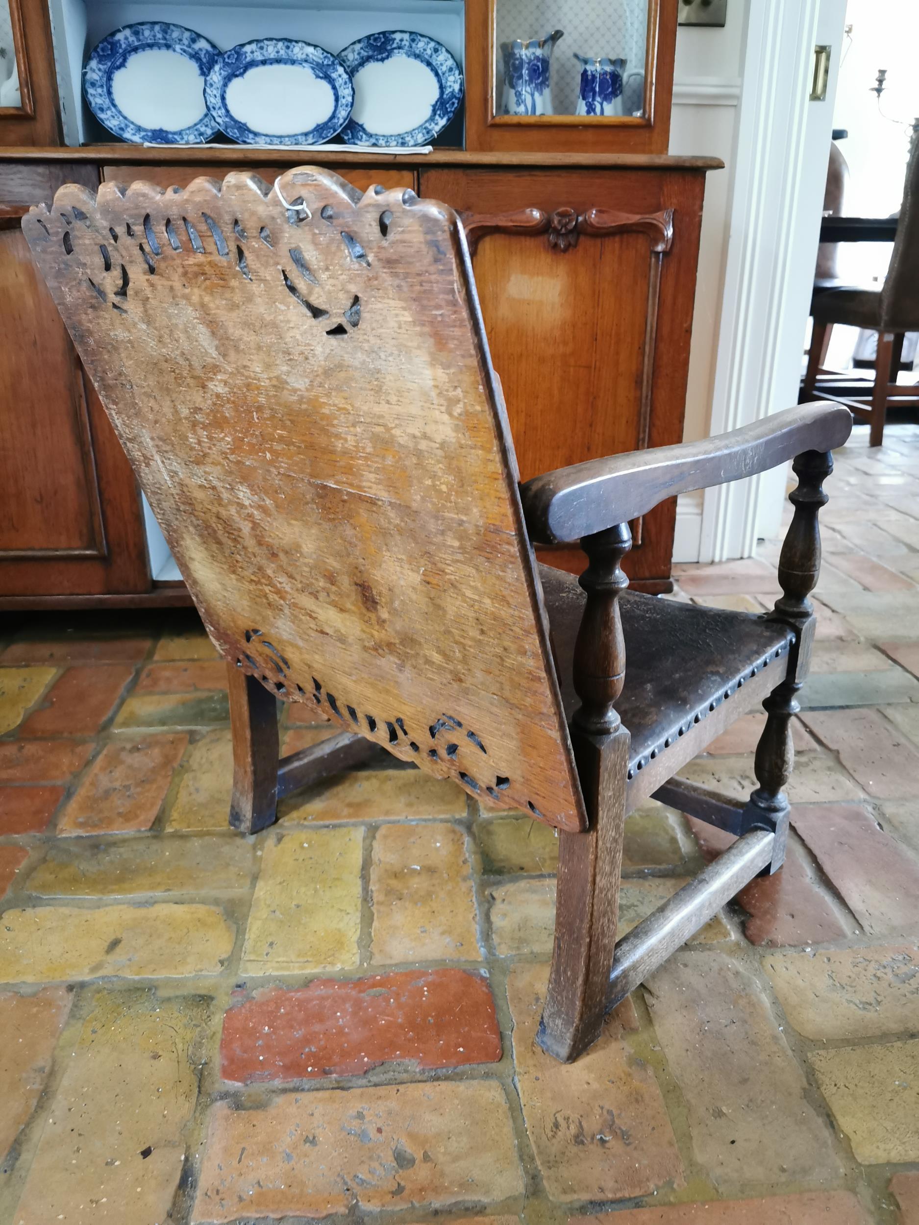 Unusal Edwardian oak settle chair with leather upholstered seat and raised on turned legs { 55cm H X - Image 3 of 4