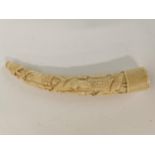 Carved African horn decorated with figures. {24 cm H}.
