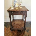 19th. C. carved oak two tier centre table raised on turned legs { 71cm H X 46cm W X 45cm D }