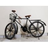 Model of messenger's bicycle { 25cm H X 46cm W }.