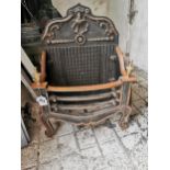 Cast iron and brass dog grate { 66cm H X 48cm W X 29cm D }.